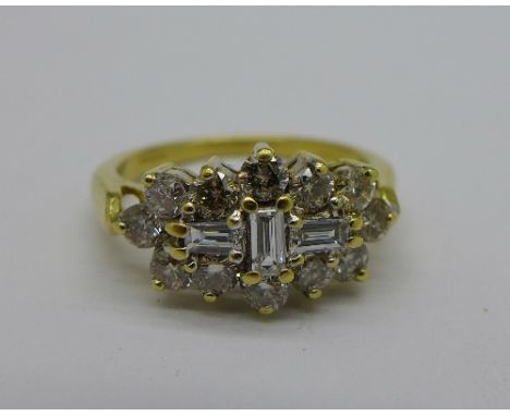 An 18ct gold and diamond cluster ring, stamped 1.00ct diamond weight, 3.9g, K½