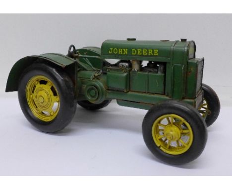 A pressed steel John Deere tractor