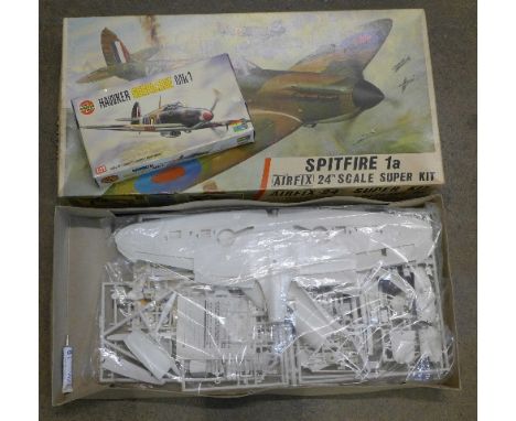 An Airfix 1:24 scale Super Kit, Spitfire 1a and an Airfix 1:72 scale Hawker Hurricane Mk1