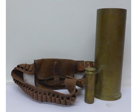 Two trench art shell cases and a bullet belt