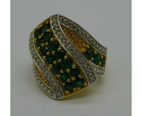 A silver gilt, emerald and diamond ring, N