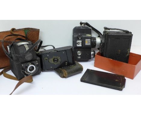 A Kodak 1913 patent vest pocket camera, a Minolta 110 zoom SLR, an Ensign ful-vue camera and one other