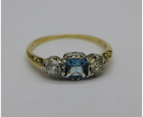 An 18ct gold, blue stone and diamond ring, 2.2g, O