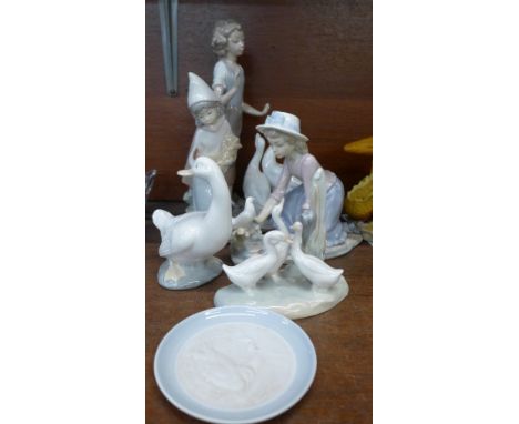 Four Nao figures, with geese and doves, a Lladro figure, girl with chicken and a Lladro dish (6), large Nao figure a/f