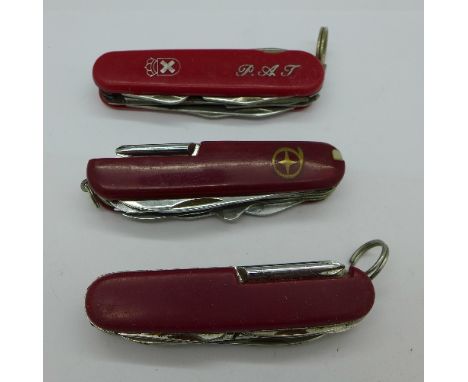 Three Swiss Army knives
