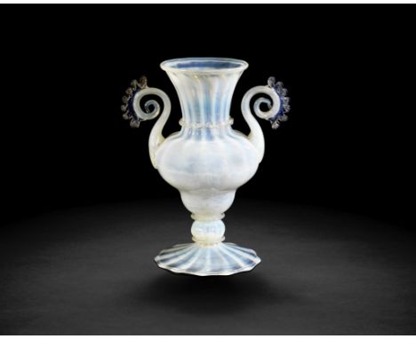 A very rare Venetian opalescent glass vase, circa 1700Of double ogee form moulded with fourteen vertical ribs, the flared nec