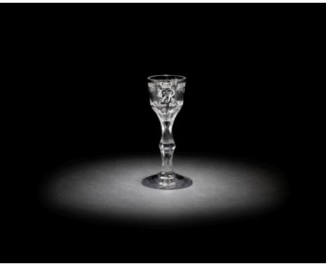 An important wine glass commemorating Sir William Howe and the capture of New York, circa 1776The ogee bowl engraved with the