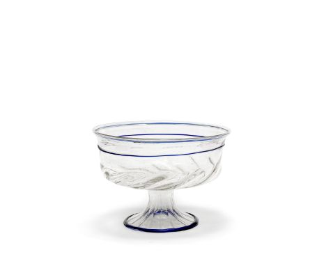 A large Venetian footed bowl, 16th centuryOf flared circular form with a spiral gadrooned base and fluted pedestal foot, the 
