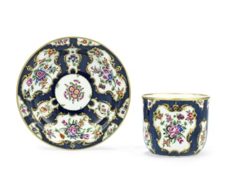 A rare Worcester finger bowl and stand, circa 1770Of plain U-shape, richly decorated with swags of colourful flowers within g