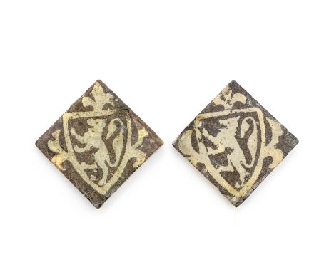 Two medieval armorial encaustic floor tiles, 14th centuryInlaid in cream clay with a lion rampant within a shield surmounted 