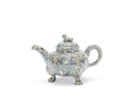 A Staffordshire solid agate teapot and cover, circa 1750-60Of compressed globular form, raised on three paw feet with lion ma