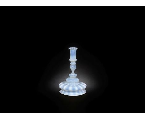 A very rare Venetian opalescent glass candlestick, circa 1700The tall cylindrical nozzle moulded with twelve ribs and folded 