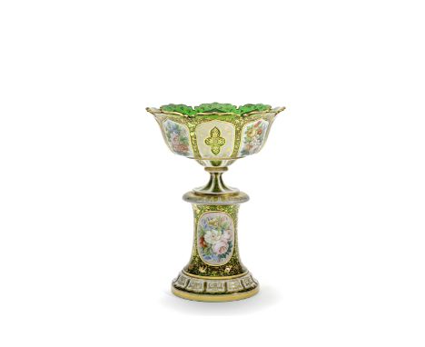 A Bohemian overlay pedestal bowl, circa 1860In green glass overlaid in opaque white, the bowl with a scalloped rim and a flar