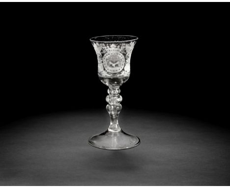 A Dutch engraved goblet, mid-18th centuryThe bell bowl with a solid beaded base, decorated with a crowned cartouche containin