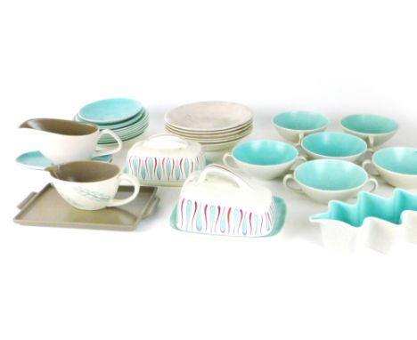 A group of Poole tablewares including a pair of cheese dishes and covers decorated in the UFT pattern and a wave-design troug