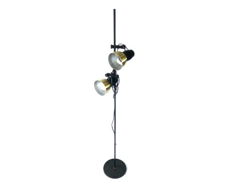 A 1970's standard lamp, the black shaft supporting two adjustable brass coloured shades