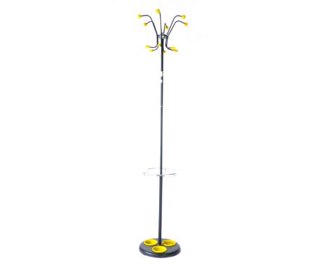 A 1960's hat and coat stand, the twelve yellow plastic hooks on a single black shaft with a circular base CONDITION REPORT: S