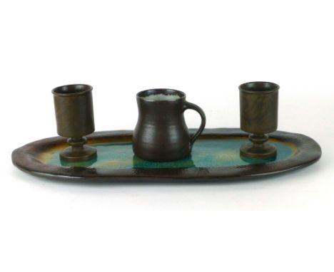 Michael Leach for Yelland Pottery, a studio pottery mug, h. 10 cm, together with a pair of drinking vessels by Roger Gilding 