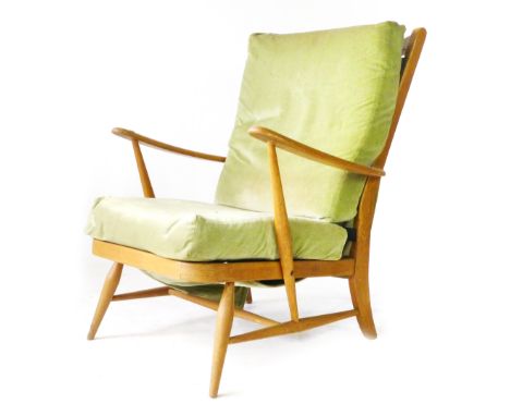 An Ercol beech armchair with loose cushions CONDITION REPORT: Splits to joints and wear