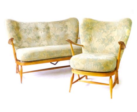 An Ercol beech and button upholstered two seater sofa together with a matching armchair CONDITION REPORT: Tired, in need of c