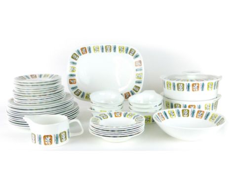 A J&G Meakin part dinner service including two tureens and milk jug, decorated with colourful plants on a white ground, toget