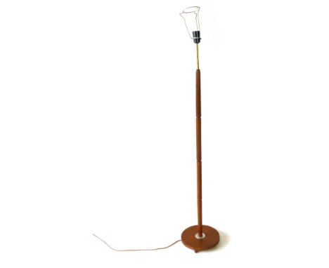 A 1970's turned teak standard lamp CONDITION REPORT: Working order unknown, lead cut, knocks and wear, no shade and fitting w