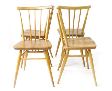 A set of four Ercol elm and beech spindle back dining chairs CONDITION REPORT: Structurally sound but with normal wear and sc