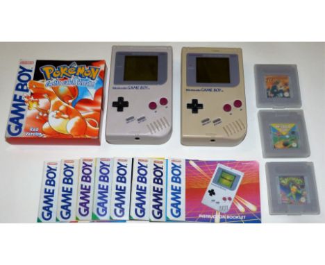 Two Nintendo Game BoysOriginal DMG-01 models one is numbered G18544015 and the other is G33547792. These 8-bit hand held vide