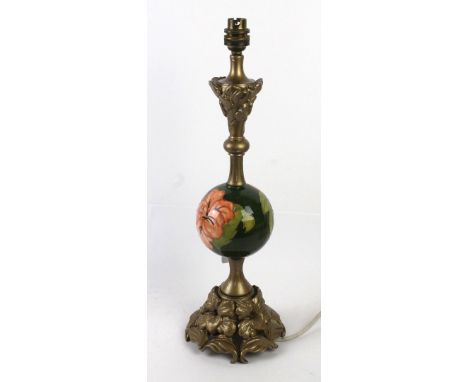 A Walter Moorcroft table lamp With circular ceramic centre decorated in the Hibiscus pattern, inset within gilt floral column