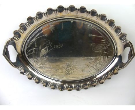An excellent quality Aesthetic Movement twin handled silver-plated trayOf oval form, having pie crust edge with central engra