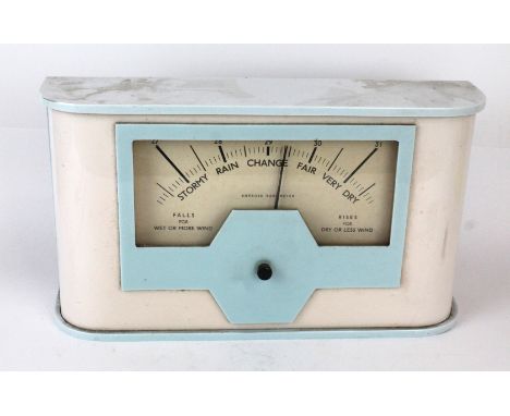 An Art Deco bakelite desk thermometer Fitted in blue and white bakelite case, height 20cm, length 35cm