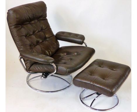 A mid Century Norwegian swivel reclining armchair and matching ottomanUpholstered in a brown button back leather material, wi