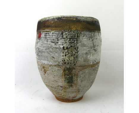 Robin Welch (b.1936-) studio pottery vesselOf cylindrical form, having a gilt rim and incised decoration to body with red gla