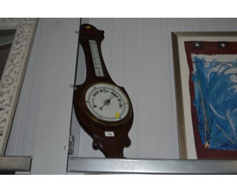 An oak cased barometer