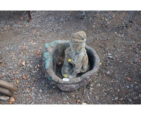 A concrete planter; together with a concrete garden ornament in the form of a fisherman
