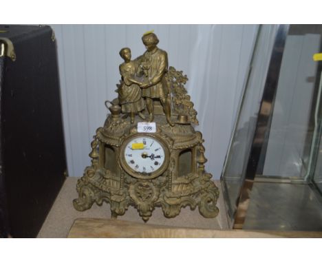 A brass cased mantle clock