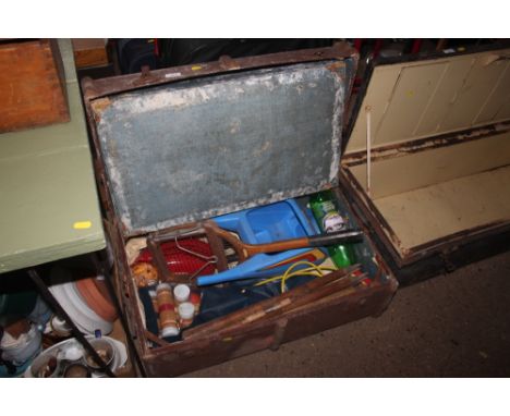 A wooden bound travelling trunk and contents of various sundry items 