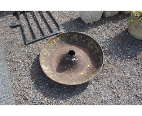 A cast iron pig trough