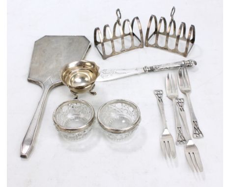 A group of variously hallmarked silver items to include a pair of small lancet shaped four division toast racks, Adie Bros Lt