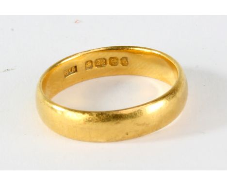 A 22ct yellow gold band, size K 1/2, approx 4.4g.