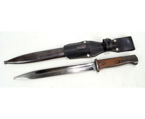 A WWI bayonet with unnamed blade, metal scabbard and later leather work, overall length 42cm. CONDITION REPORT: Wear, scratch