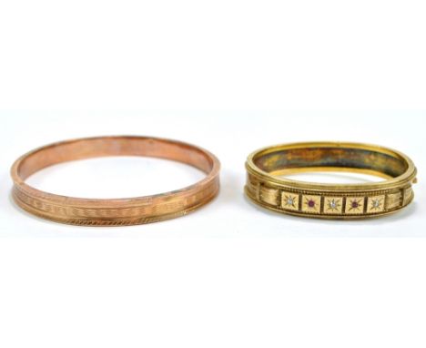 A 9ct rose gold hollow bangle with engine turned decoration to the outside, diameter 8.5cm, and a further yellow metal snap b