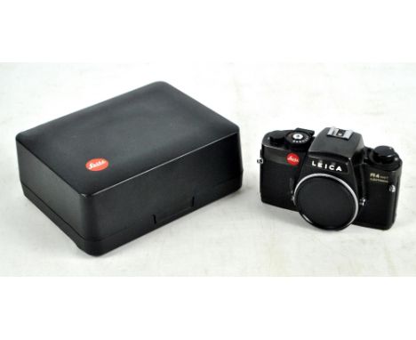 LEITZ LEICA; a cased R4 MOT electronic camera body with carrying strap, serial number 1543374 to base, also a Leica branded c
