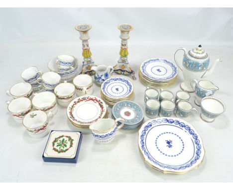 A Wedgwood six setting coffee set including a footed coffee pot and a cream jug, Royal Worcester 'Holy Ribbons' cups and sauc