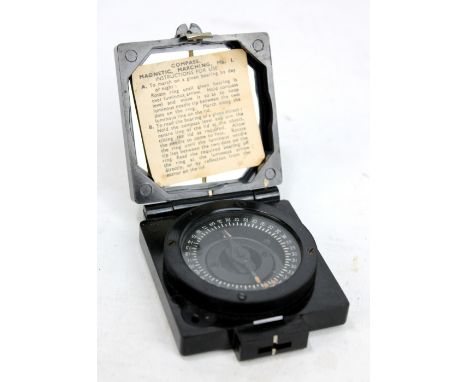 A military issue Magnetic Marching Compass Mk.1 with instruction sheet to interior and base with broad arrow mark, serial num