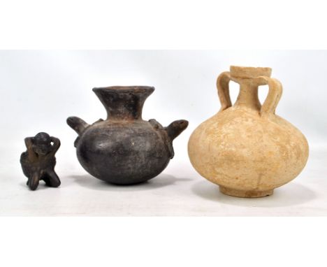 A Tunisian grey ware twin handled flagon, Punic, North Africa, 3rd/1st century BC, height 17cm, a Mayan effigy pot, circa 130