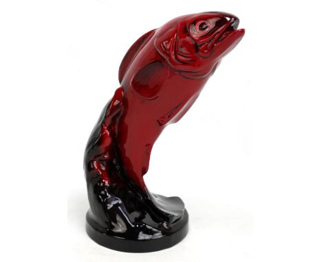 A Royal Doulton flambé figure of a leaping salmon, with FM monogram for Frederick Moore to base, height approx 31cm. CONDITIO
