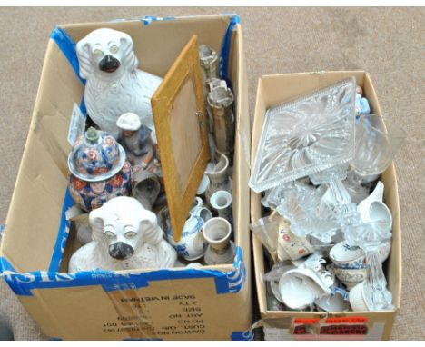 A mixed group of ceramics including a pair of Staffordshire spaniels, figure group and church facade, and further cups, sauce