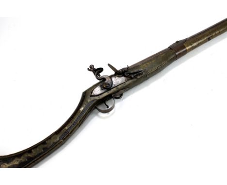 An Afghan 5-band flintlock musket with brass decorated walnut stock, length of barrel 47". CONDITION REPORT: Heavy wear throu