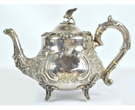 MAPPIN & WEBB; a Victorian hallmarked silver teapot of squat baluster form with two opposing vacant cartouches on floral embo